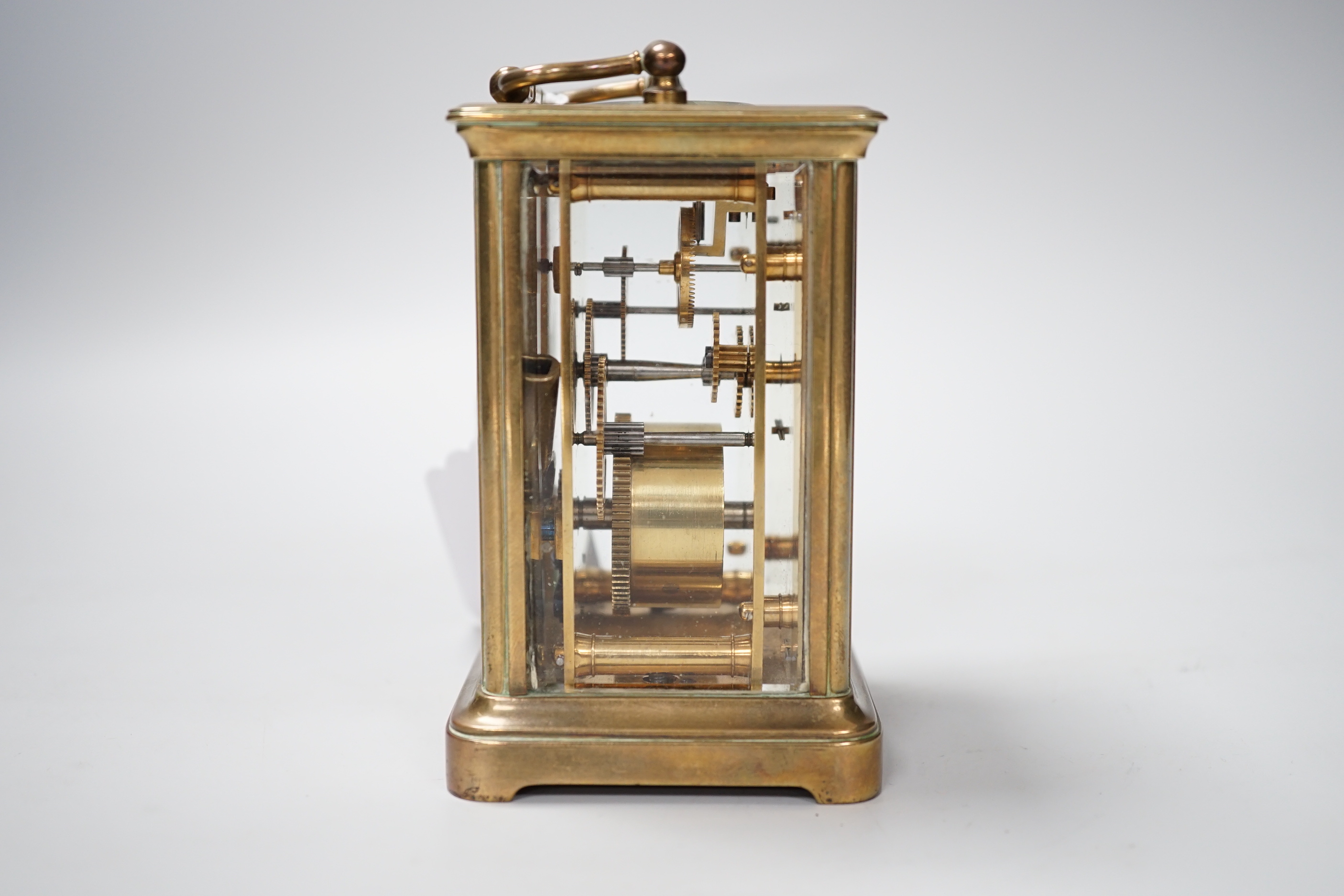 A French brass cased timepiece with silvered and enamelled dial, 12cm tall